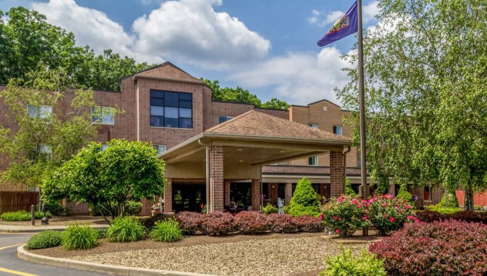 Exterior view of Whispering Oaks senior living facility