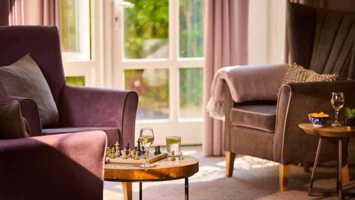 Hallmark Admiral Court, memory care — Cozy seating area with a chessboard and refreshments