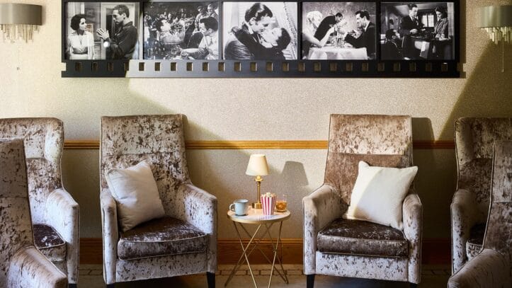 Hallmark Admiral Court, memory care — Cozy seating area with vintage black-and-white photos