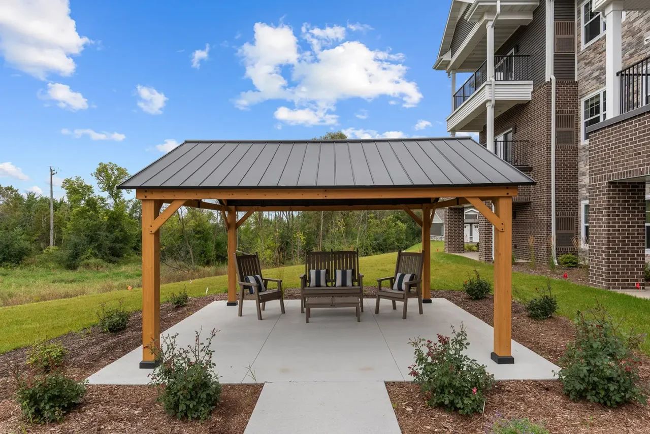 Outdoor gazebo with seating near the facility