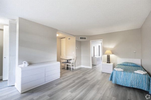 A well-furnished private resident room in a senior living facility