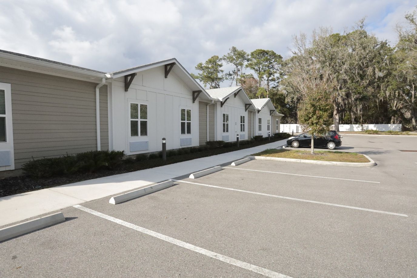 Exterior view of the facility with parking area