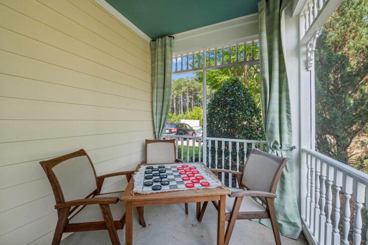 Outdoor porch area with a checkerboard game set up