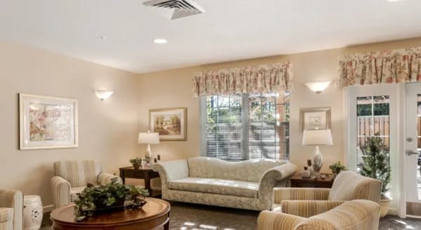 Bright common area with seating and soft lighting