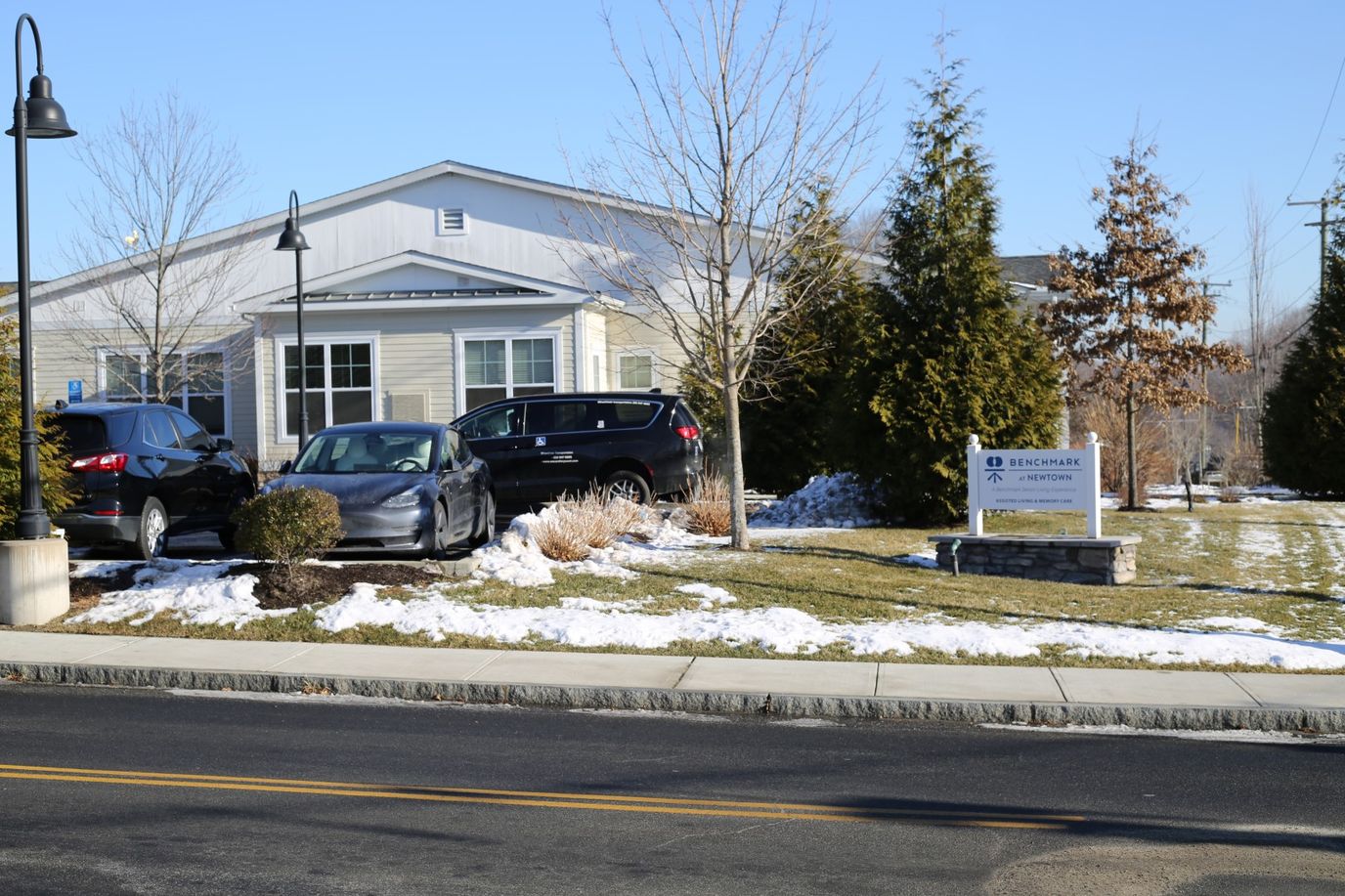 Exterior view of Benchmark at Newtown with vehicles