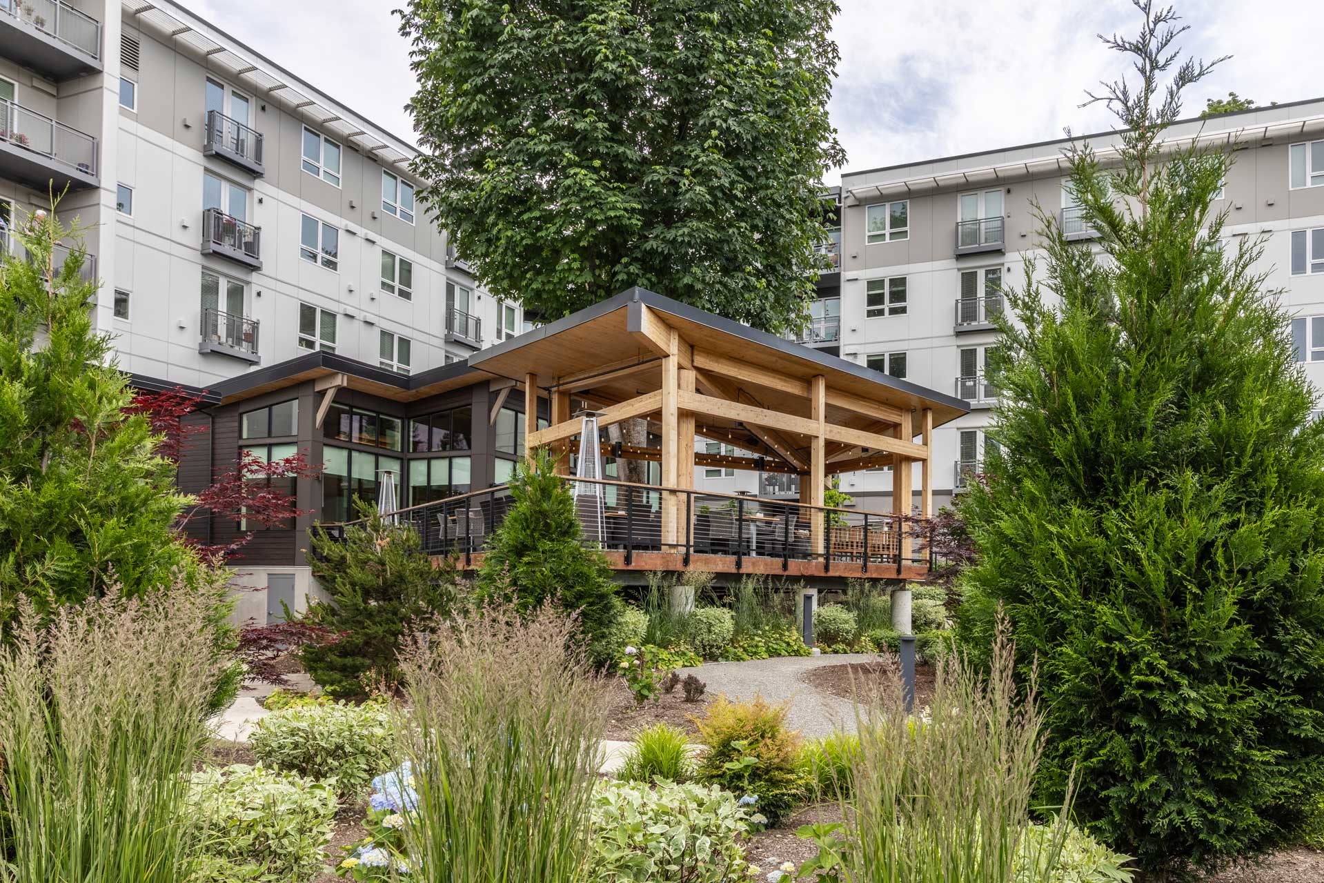Outdoor patio area surrounded by gardens