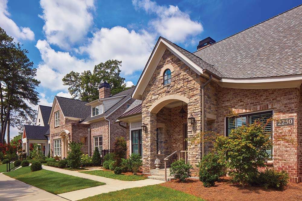 Exterior view of a senior living facility with landscaped gardens