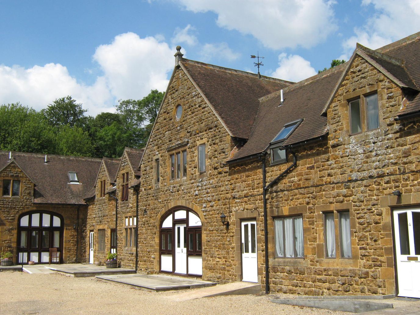 Exterior view of a stone building with blue sky