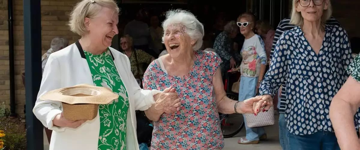 Residents enjoying an outdoor event together.