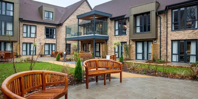 Outdoor seating area with view of the building