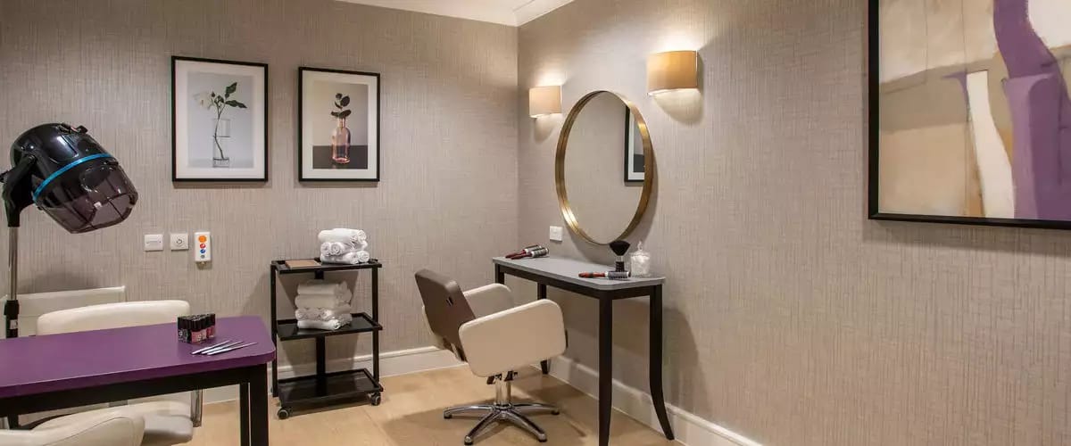 Salon space with styling chair and mirror
