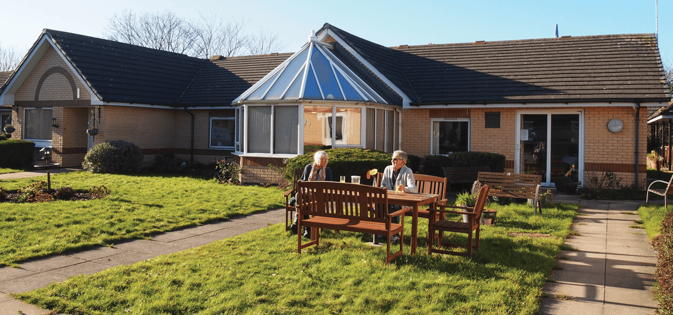 Residents enjoying the outdoors in a garden area