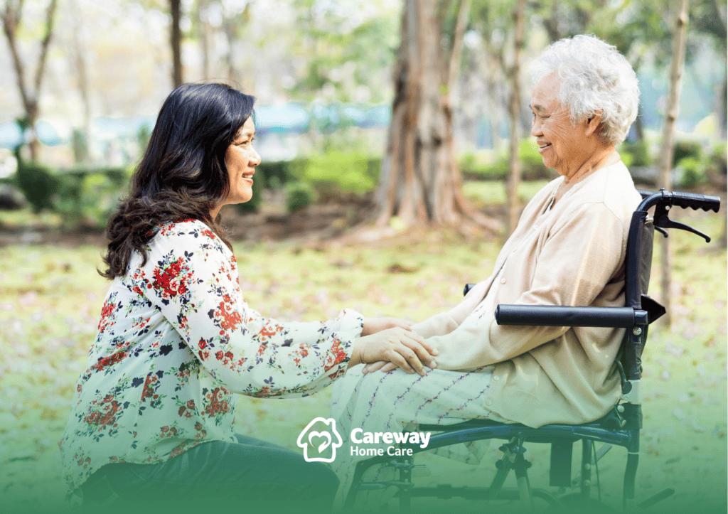 Caregiver interacting with a resident in a garden