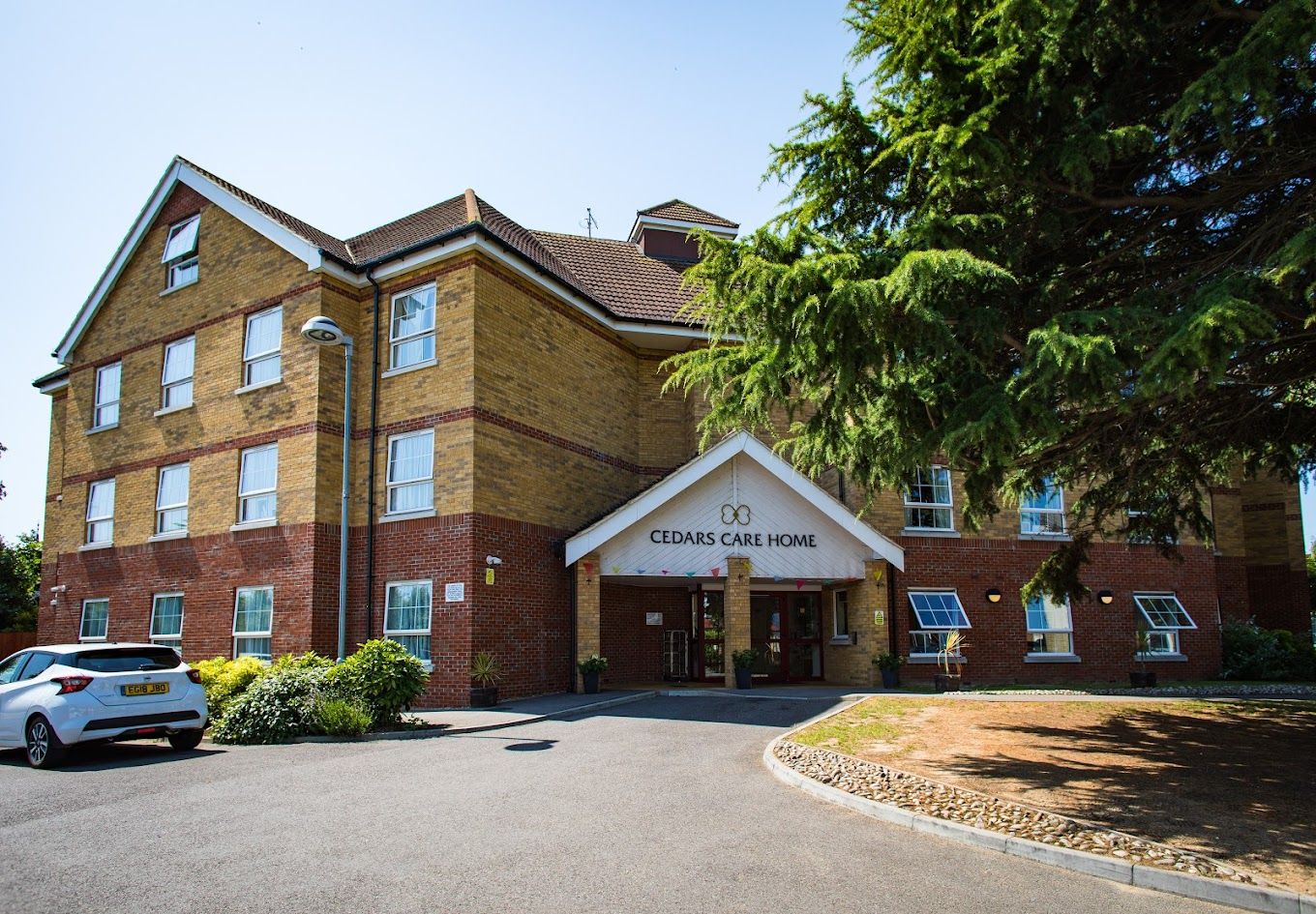 Exterior view of Cedars Care Home building