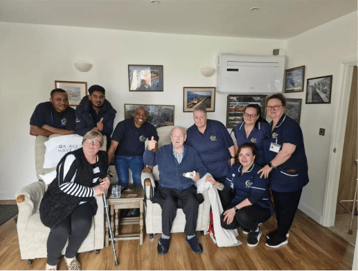 Staff and residents enjoying time together in a lounge