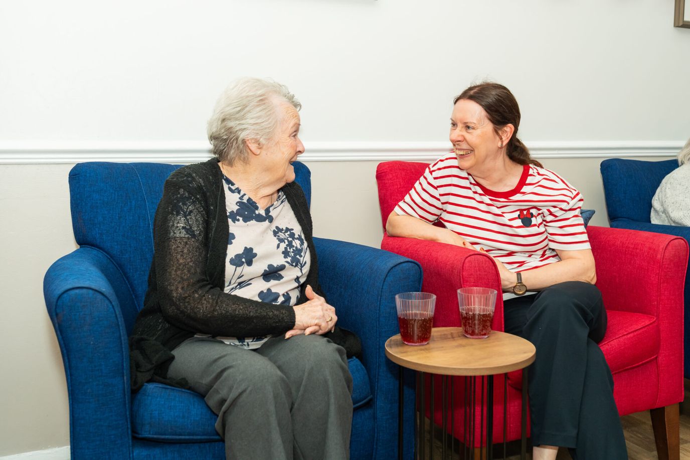Residents enjoying a conversation in a common area