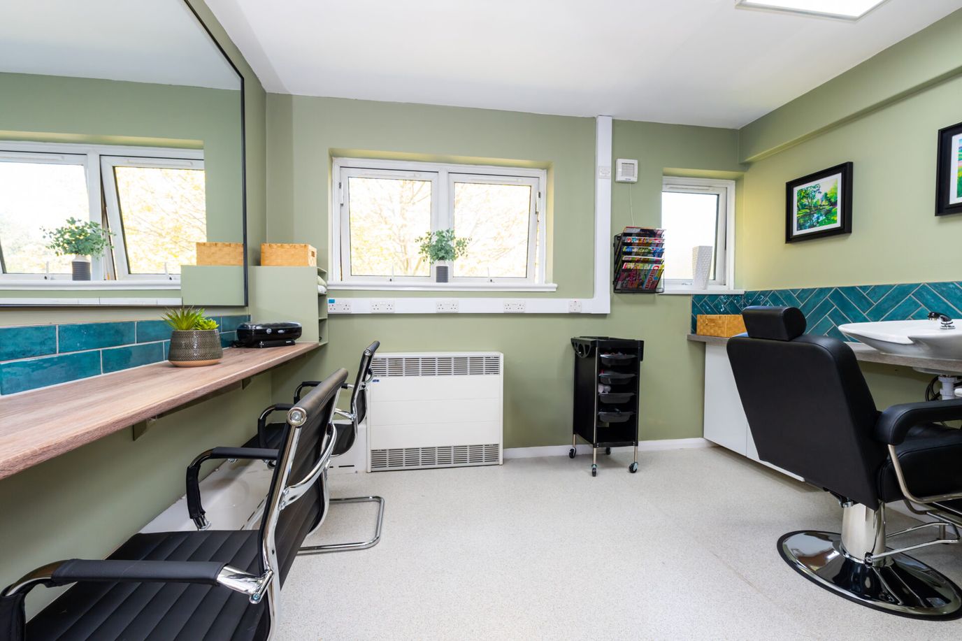 Salon space with chairs and large windows
