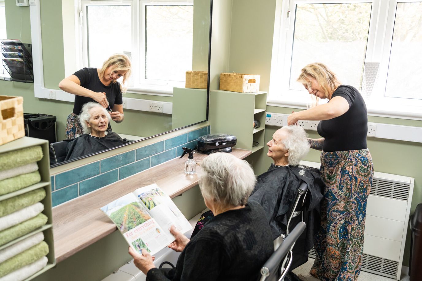 Residents getting hair services in a salon area