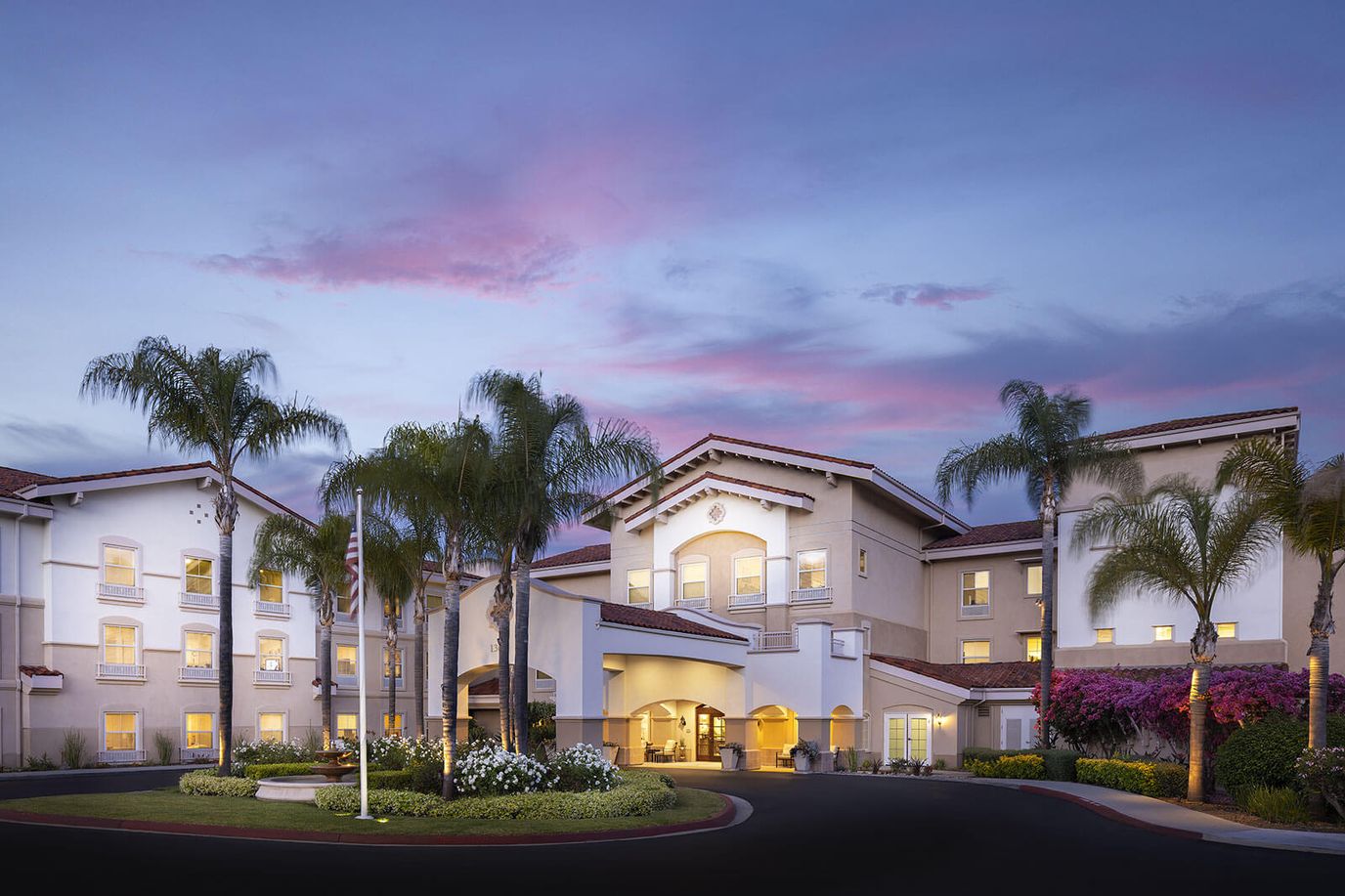 Exterior view of Belmont Village Senior Living Sabre Springs during sunset