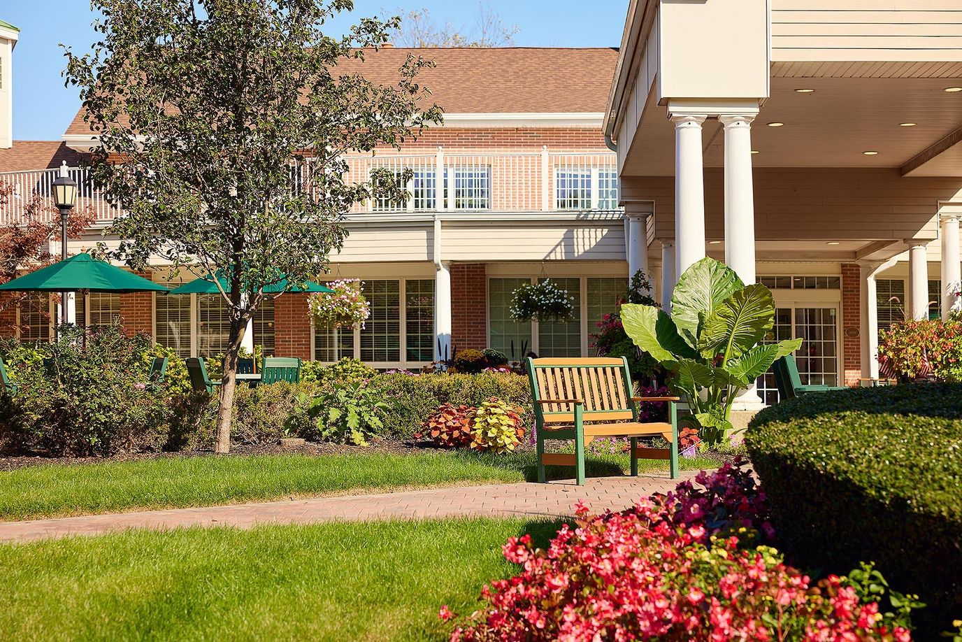 Outdoor seating area with well-maintained gardens