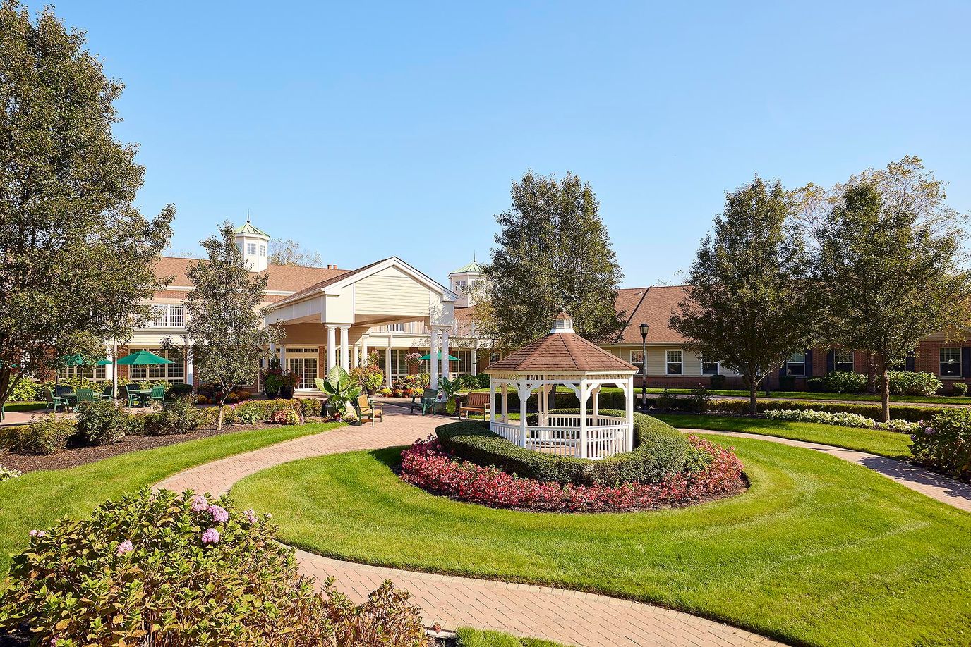 Beautiful landscaped outdoor area with gazebo and flowers