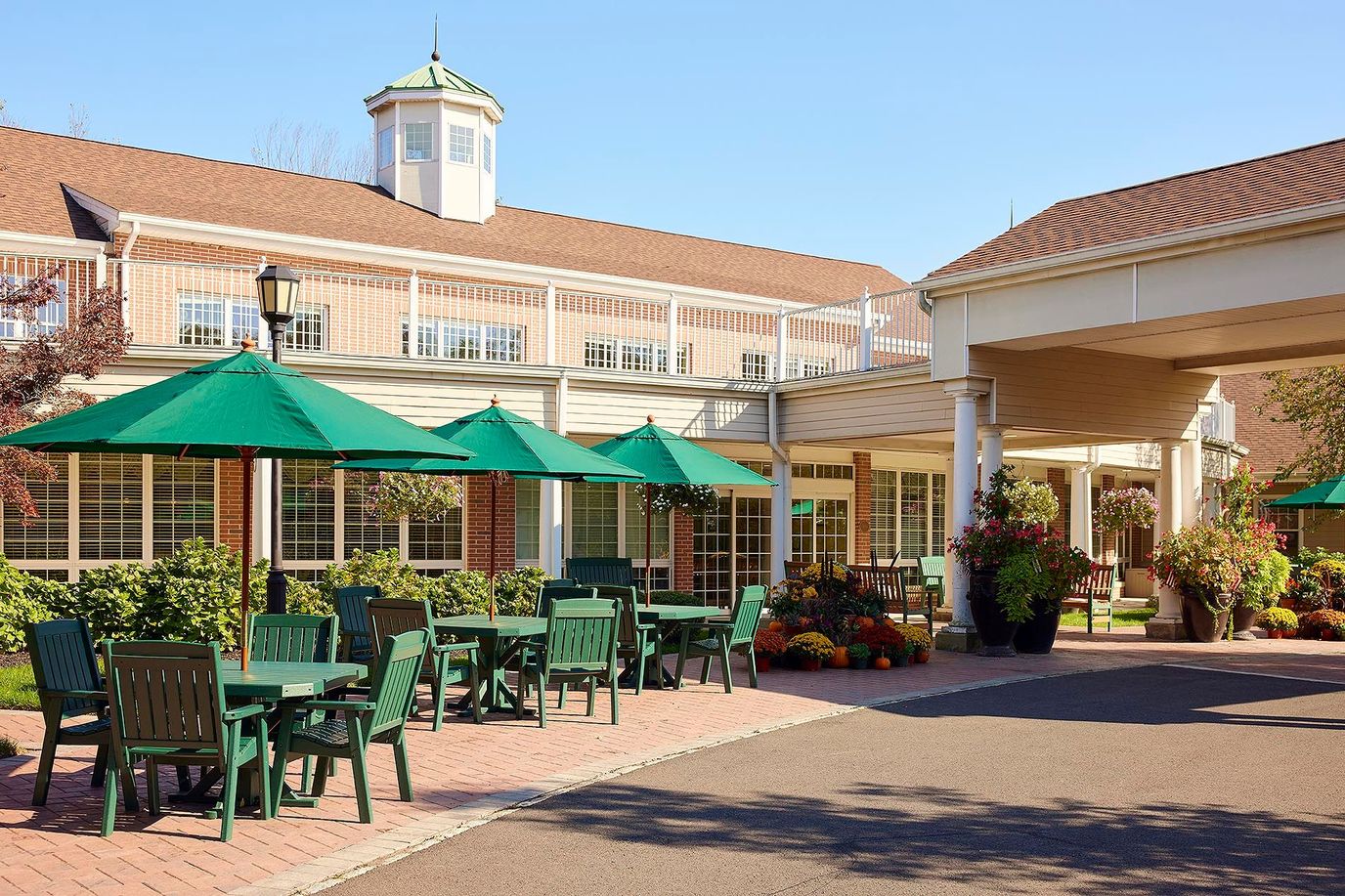 Outdoor seating area with tables and umbrellas