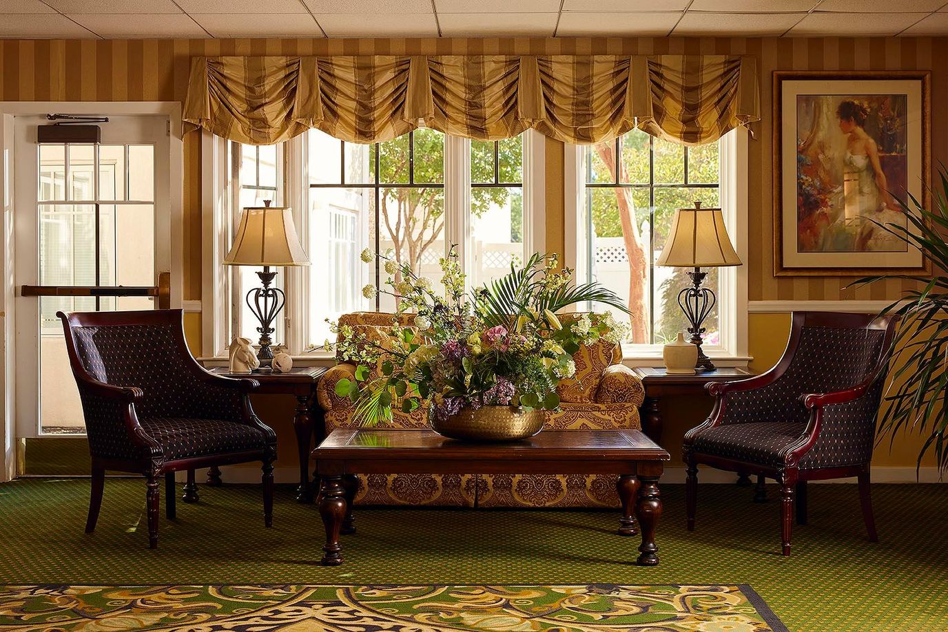 Comfortable living room with elegant decor and floral arrangement