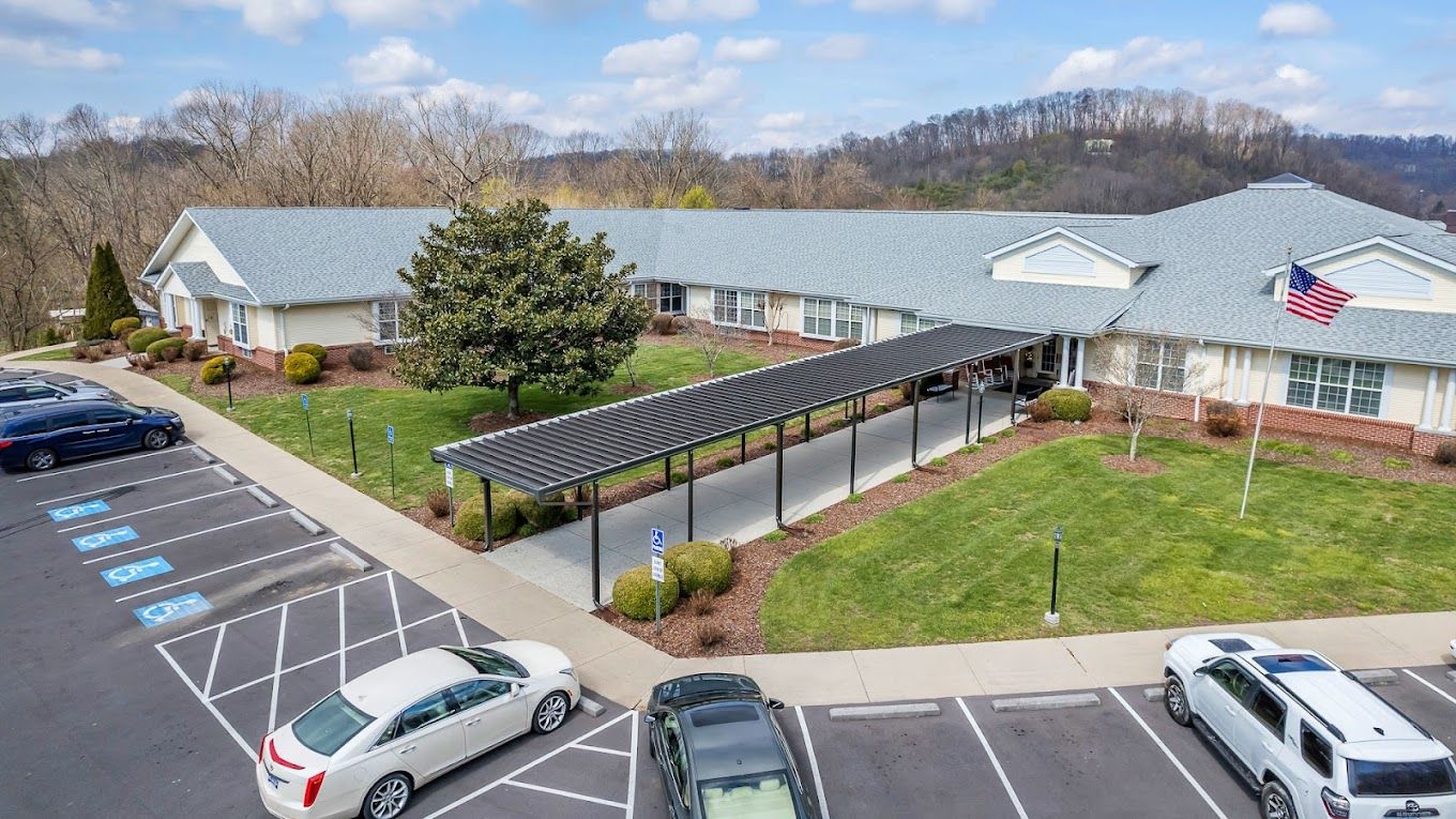 Aerial view of the facility entrance and parking area