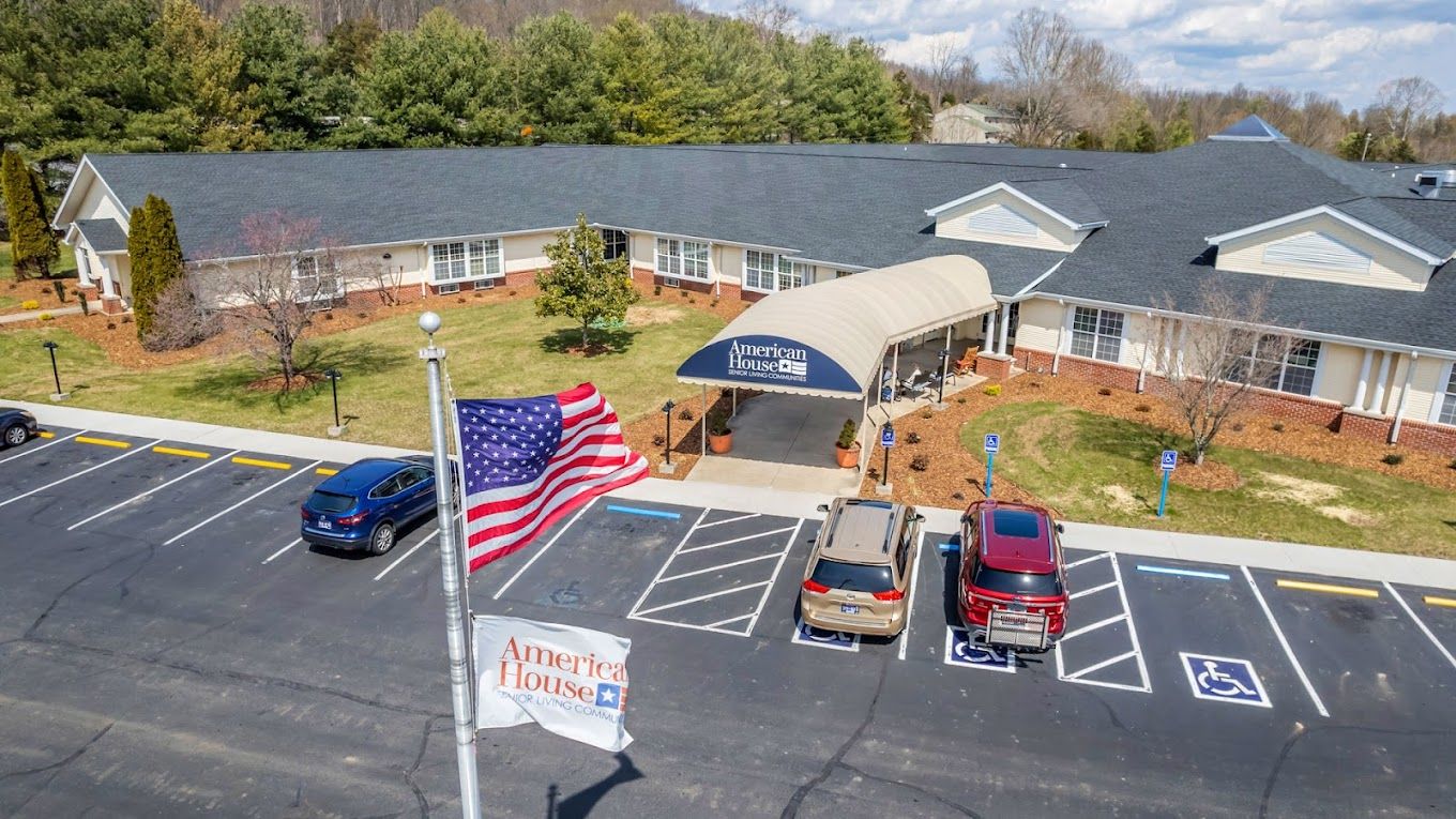 Exterior view of American House Johnson City with parking lot