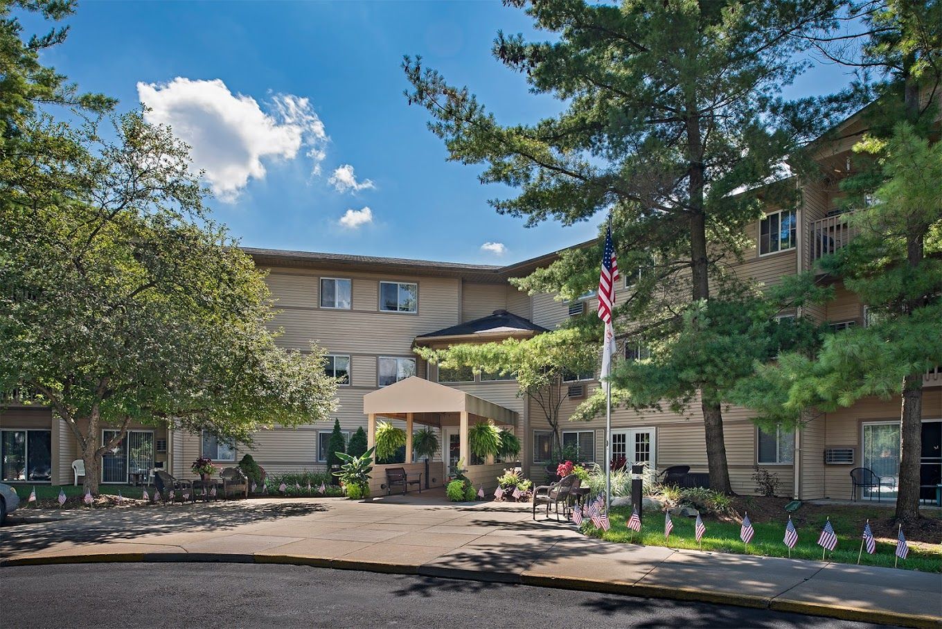 Exterior view of a senior living facility with landscaped grounds