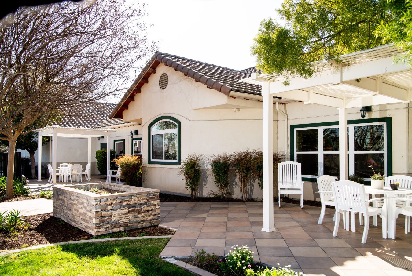 Outdoor patio area with seating and garden