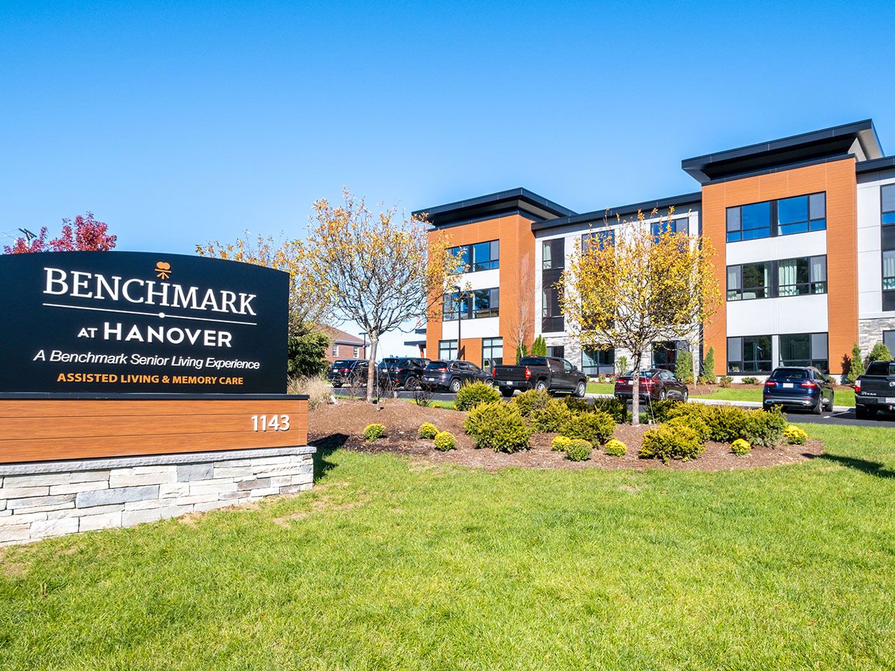 Exterior view of Benchmark at Hanover with landscaped area.