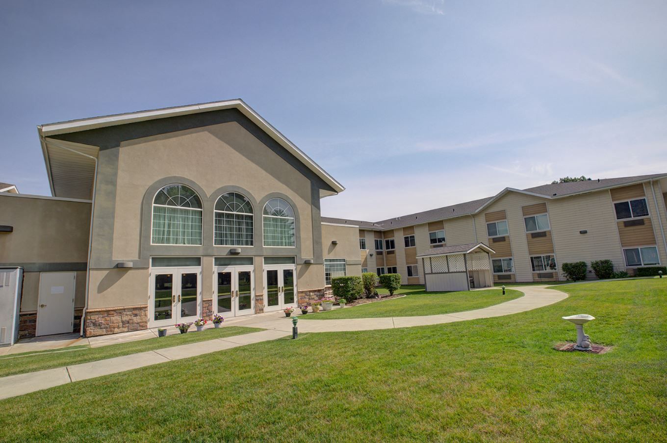 Exterior view of Blossom Valley facility with landscaped pathways