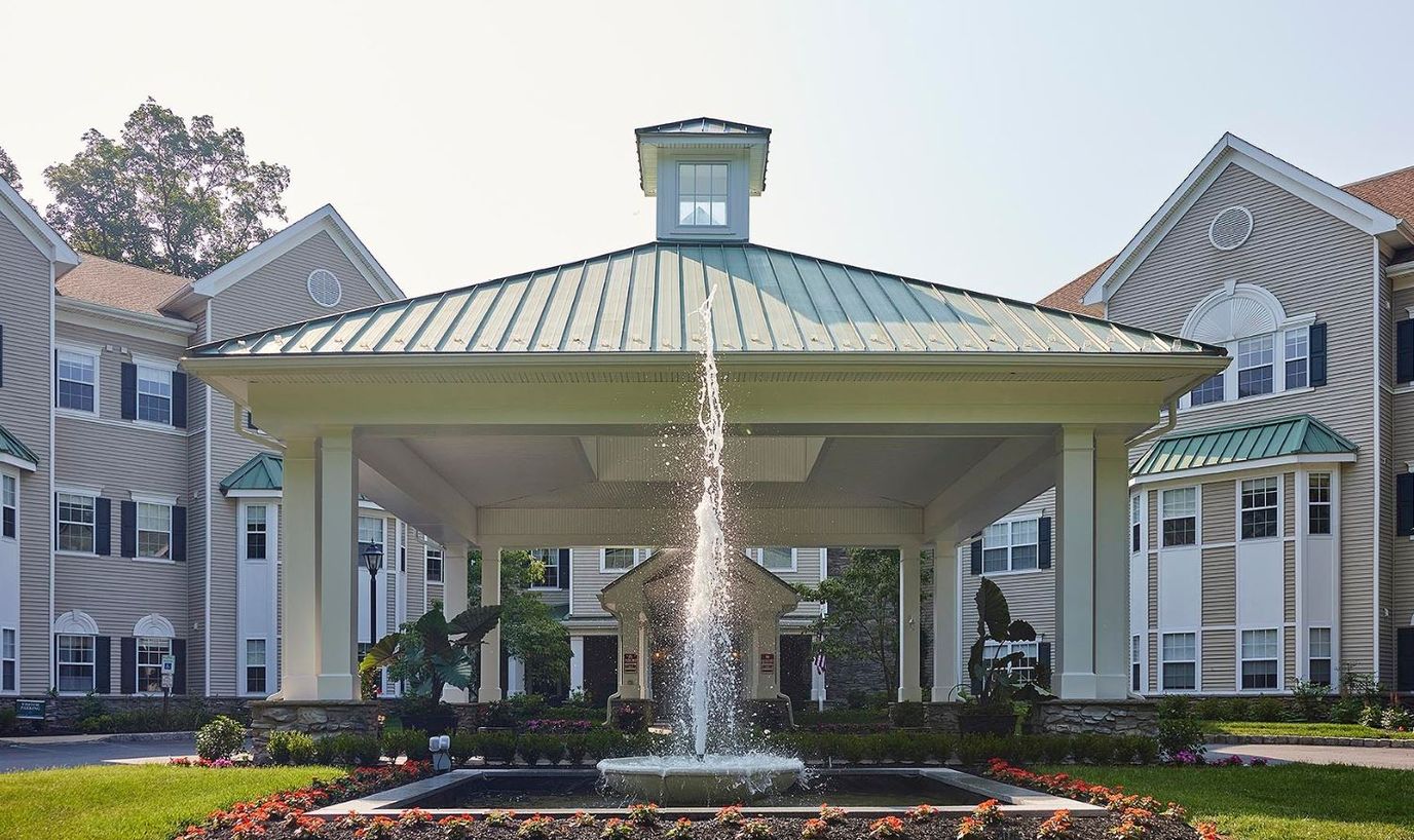 Exterior view of the facility with a fountain