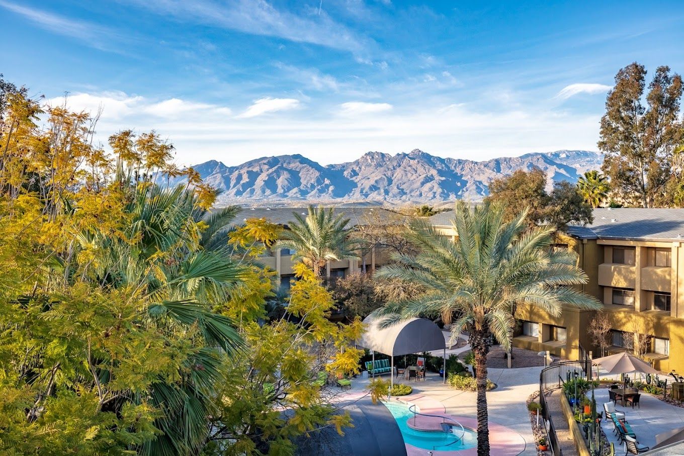 Outdoor view of the facility with trees and mountains