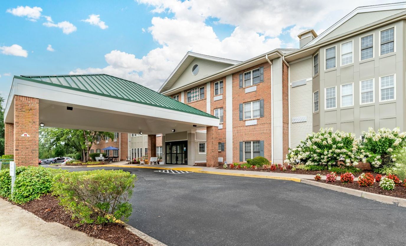 Front entrance of Brookdale Monroe with landscaping