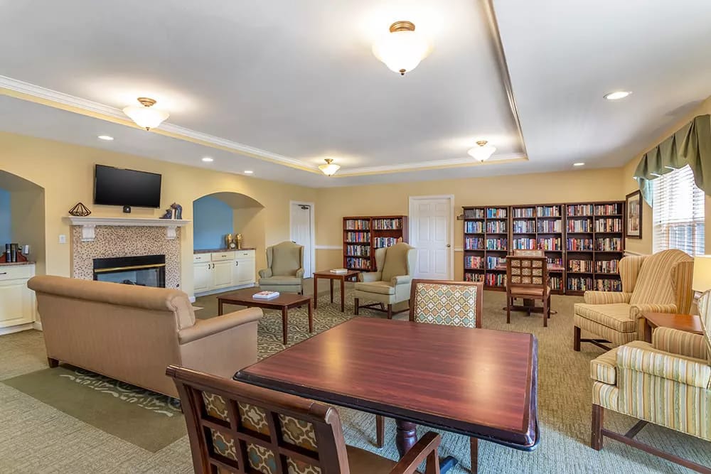 Interior common area with seating and bookshelves