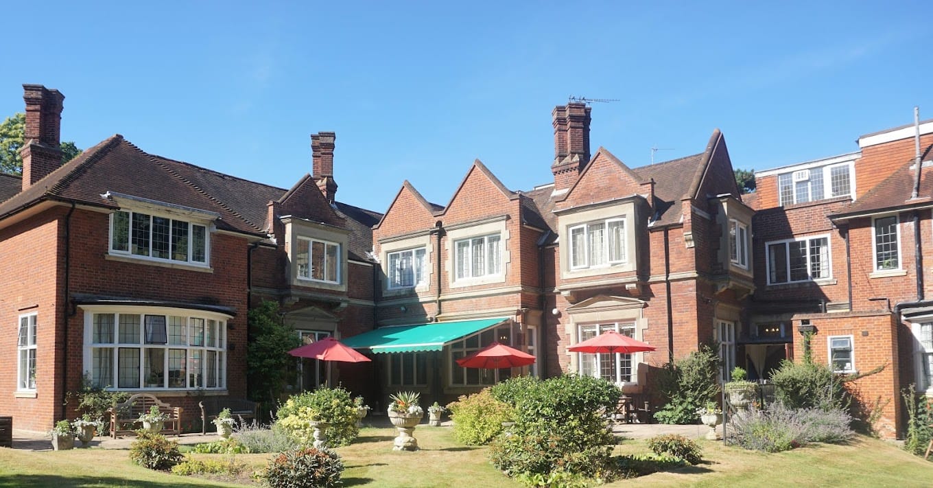 Exterior view of a brick building with a garden