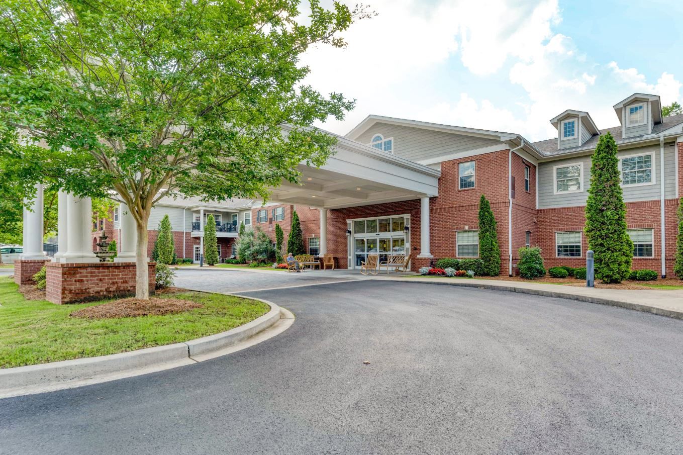 Exterior view of the facility's entrance surrounded by greenery