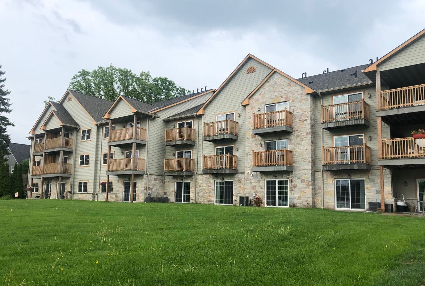 Exterior view of a senior living building with balconies