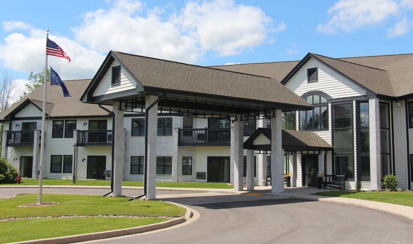 Exterior view of Charter Senior Living with entrance