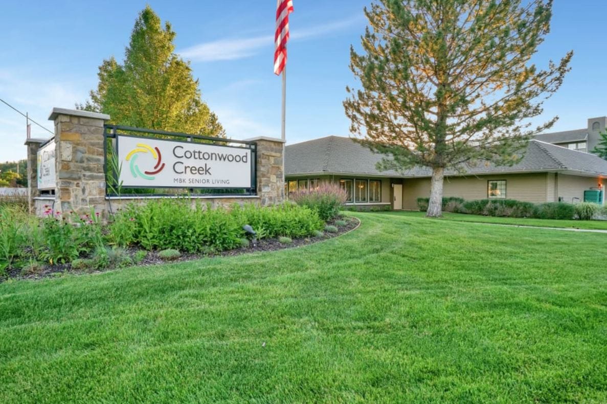 Exterior view of Cottonwood Creek facility with sign and landscaping