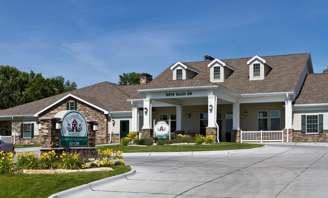 Exterior view of the Country House facility with flowers