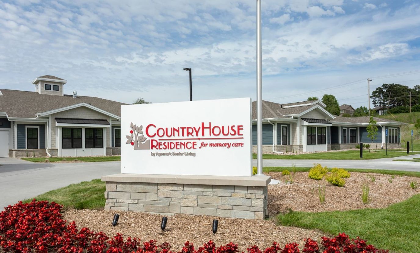 Exterior view of CountryHouse facility with sign and landscaping
