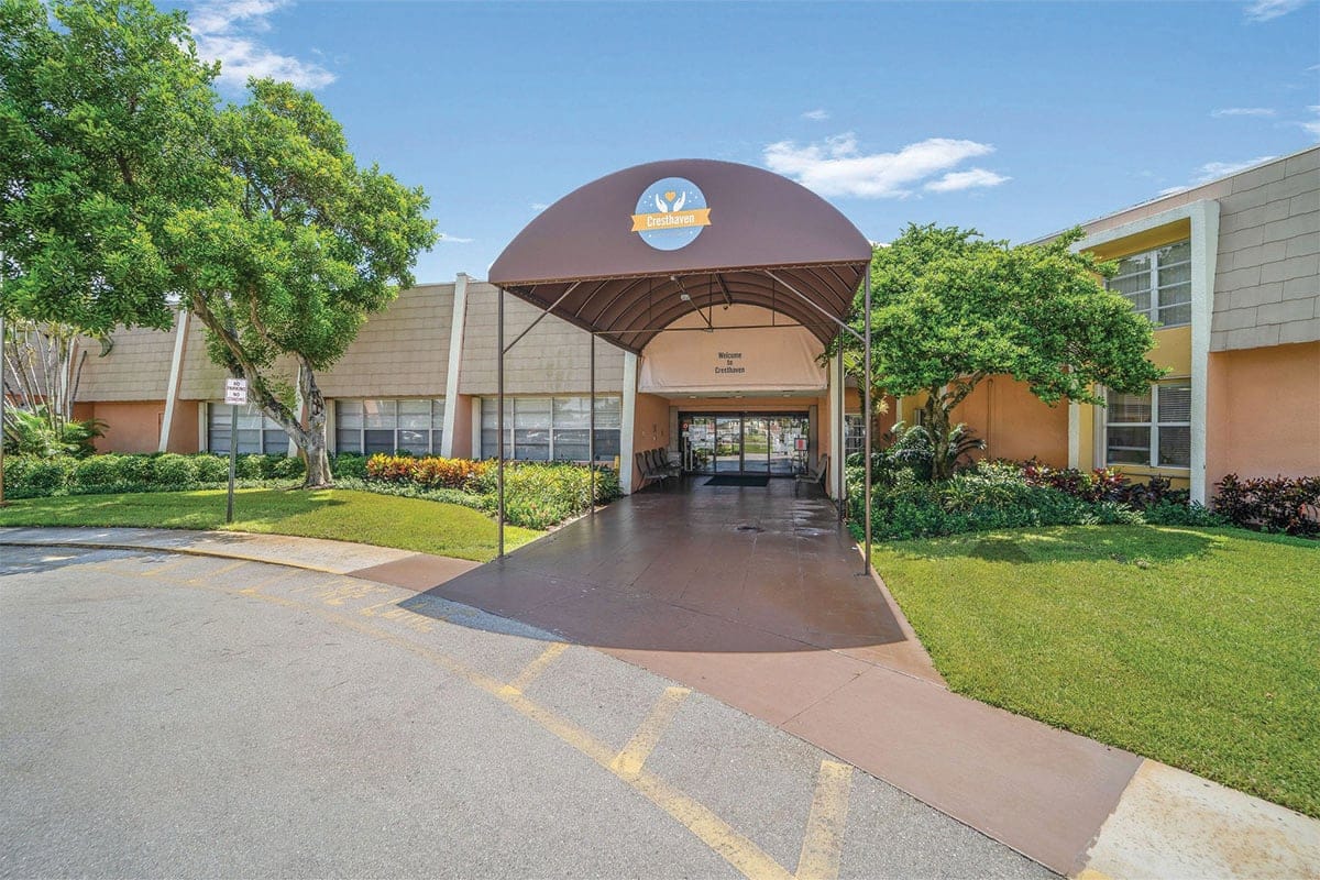 Entrance of a senior living facility with awning