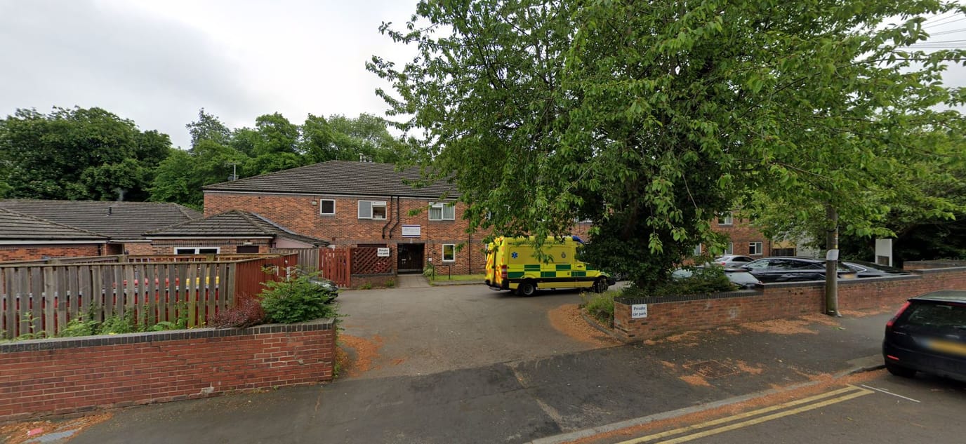 Exterior view of Eagle House with emergency vehicle