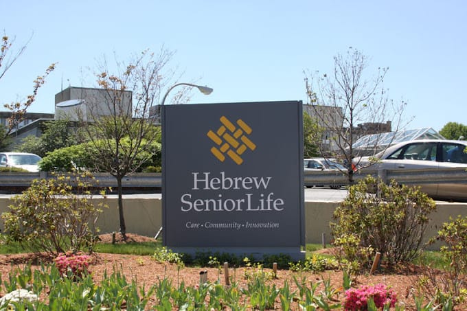 Sign for Hebrew SeniorLife at entrance