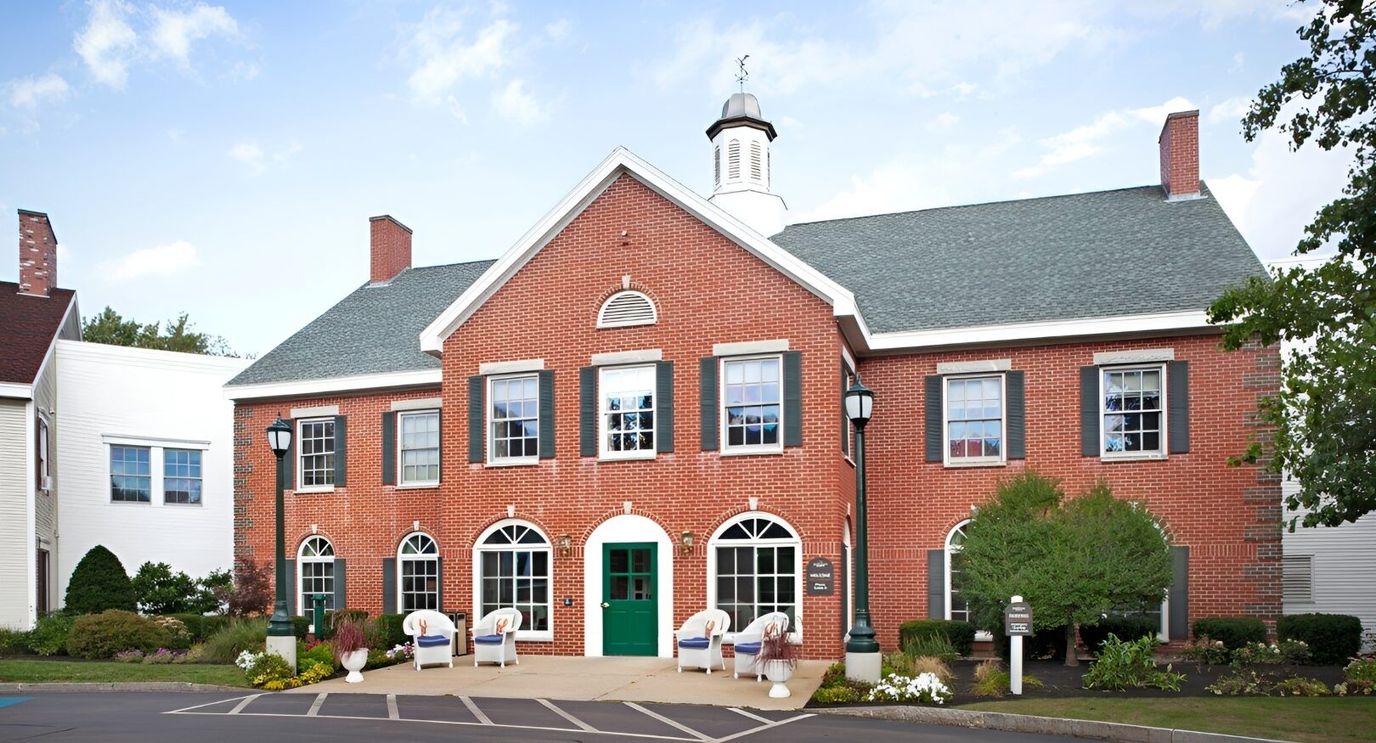 Exterior view of Huntington Common facility with gardens