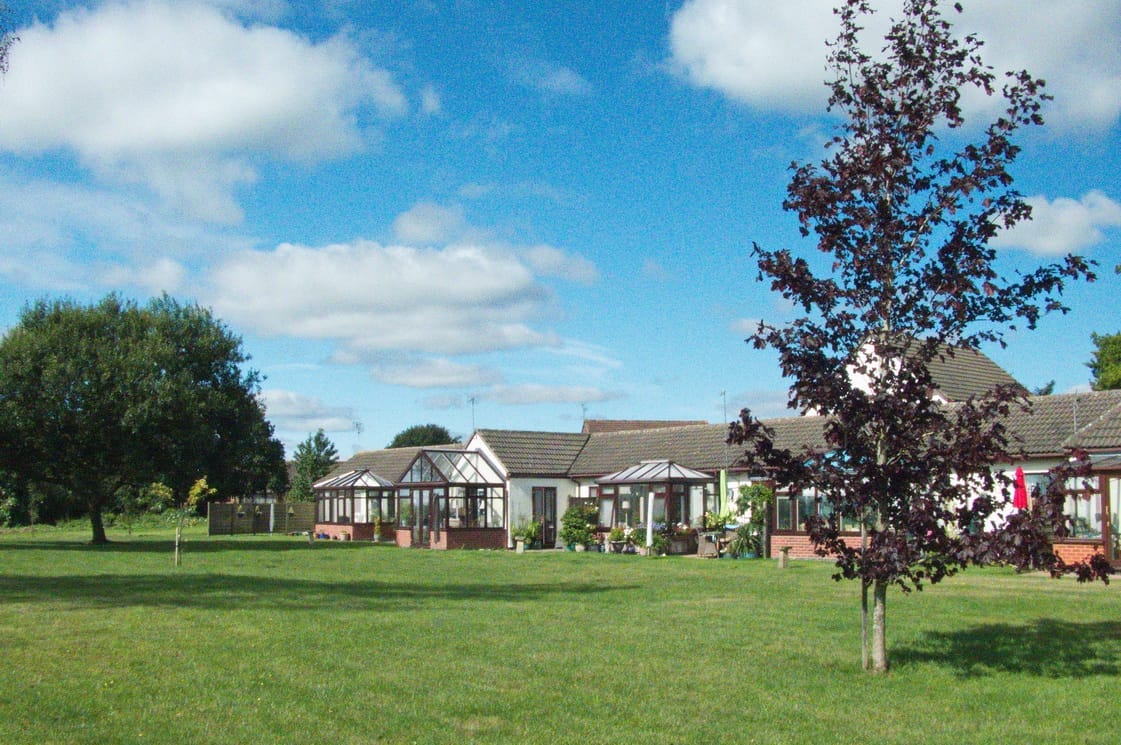 Exterior view of a retirement village with green space