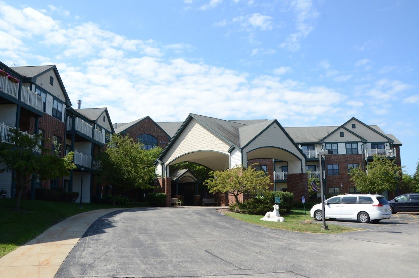 Exterior view of assisted living facility with landscaping